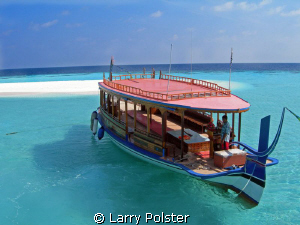 Dive boat, Angaga Island, beautiful clear waters by Larry Polster 